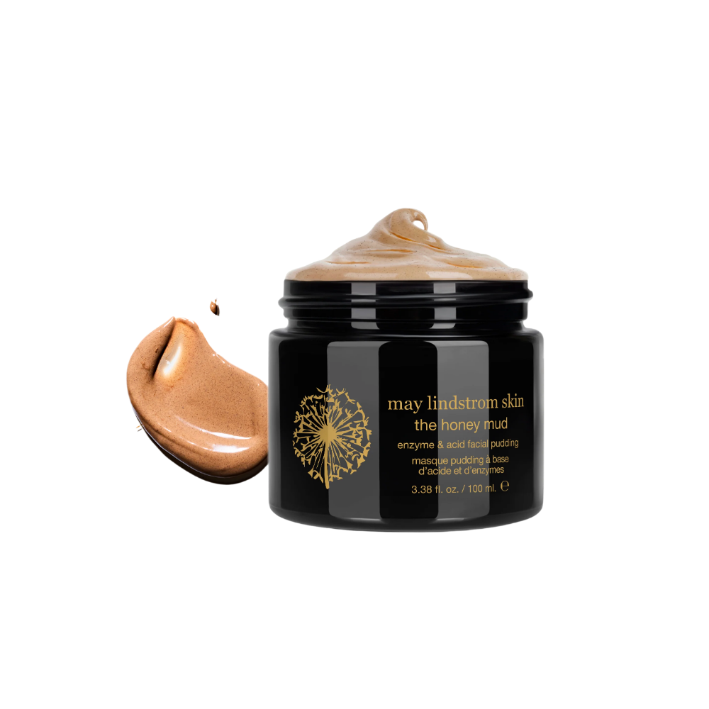 Black jar of 'The Honey Mud' by May Lindstrom with a dollop of the product on the left side