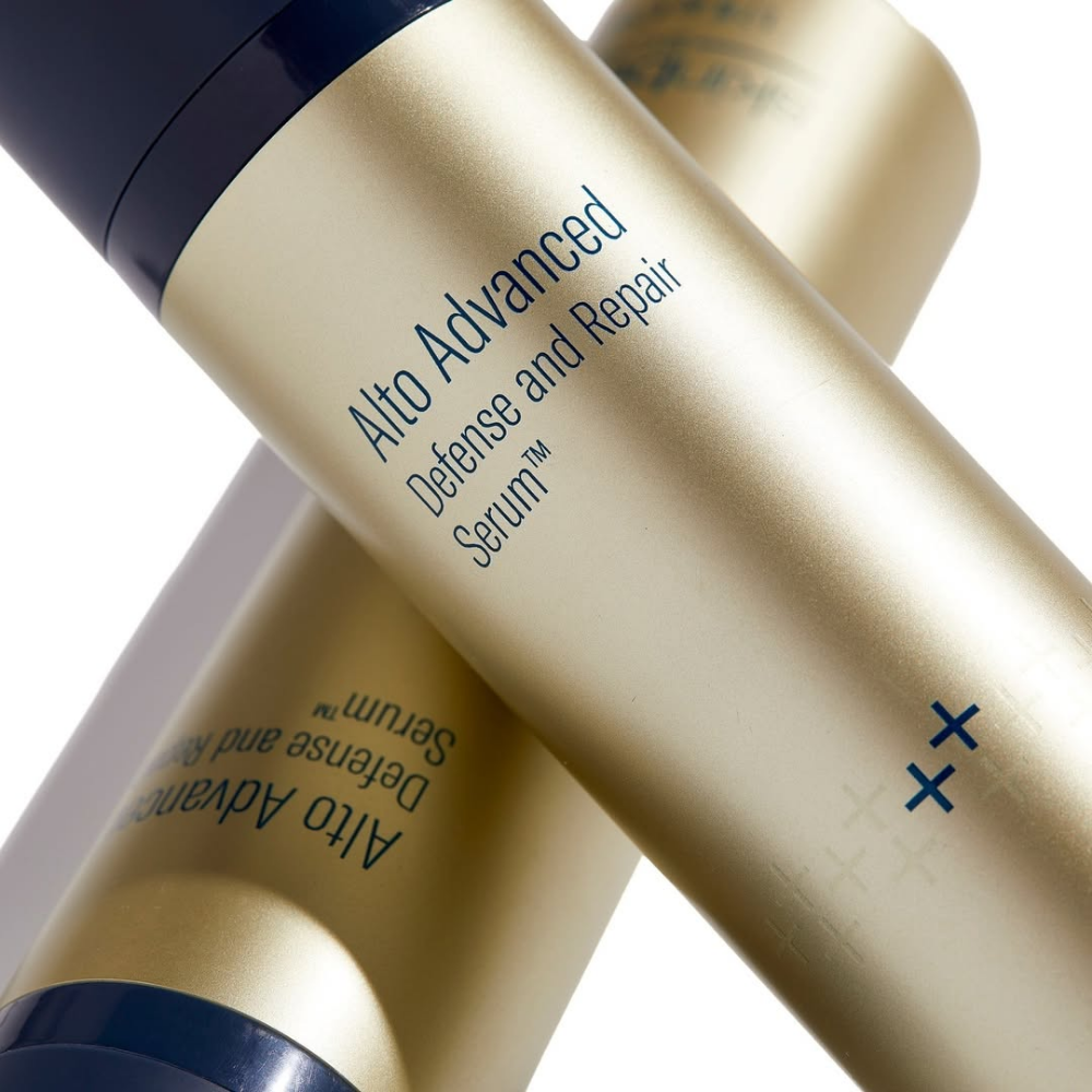 Two bottles of Skin Better Alto Advanced Defense and Repair Serum on a white background