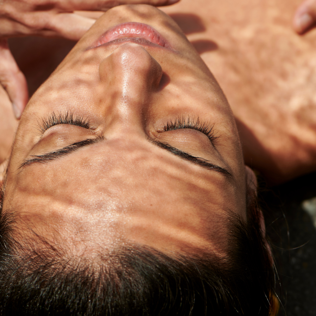 close up of a woman's face laying down