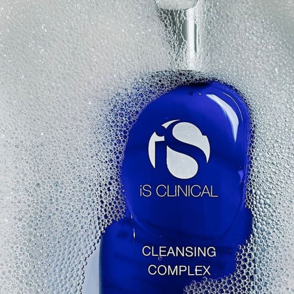 Blue bottle of iS Clinical Cleansing Complex with bubbles