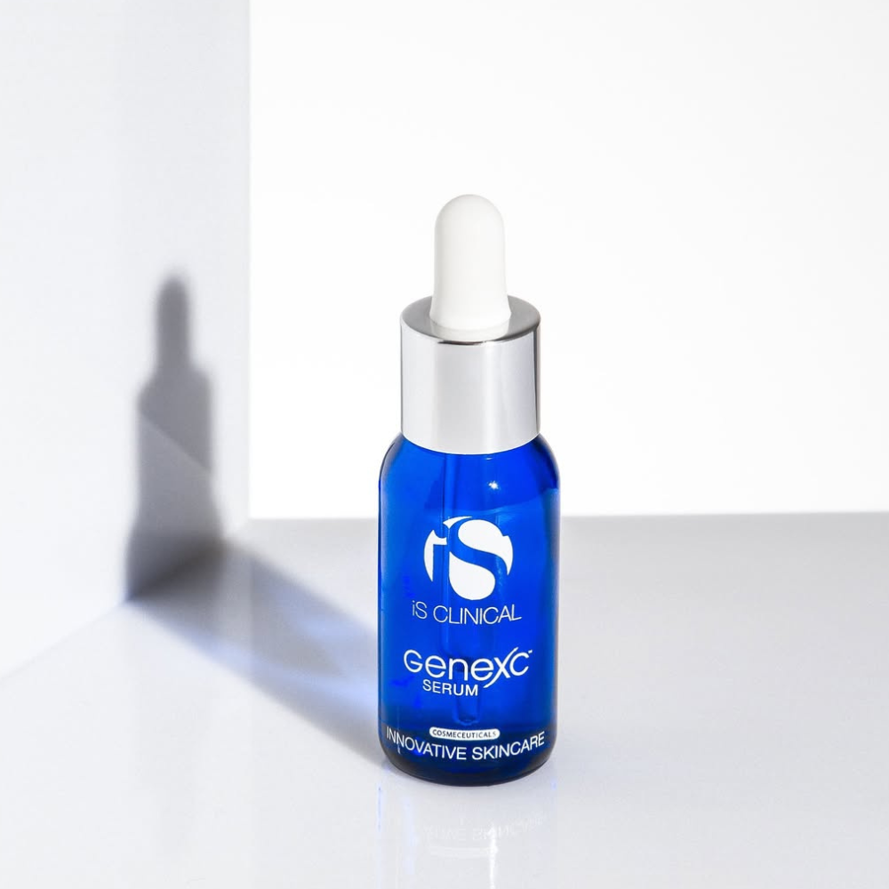 Blue serum bottle with dropper labeled iS Clinical GeneXC Serum on a white background