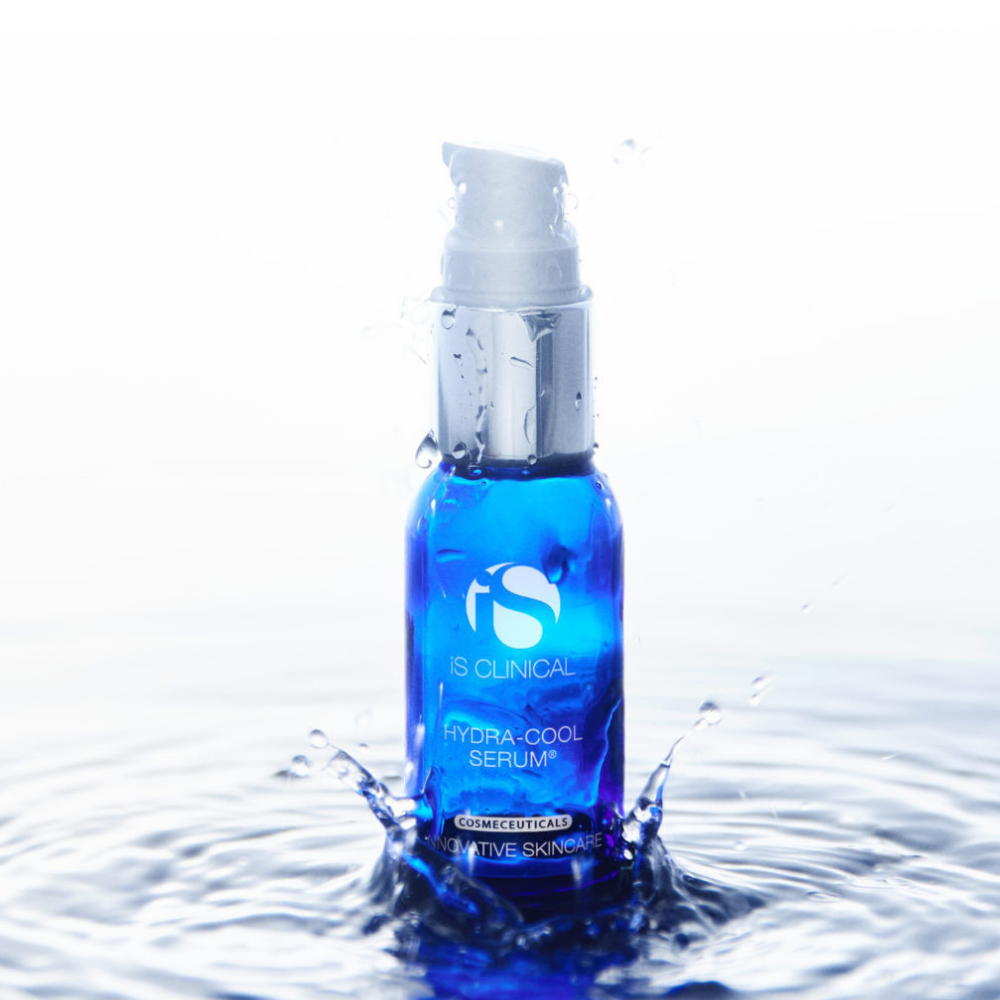 Blue serum bottle with water droplets iS Clinical Hydra-Cool Serum on a white background