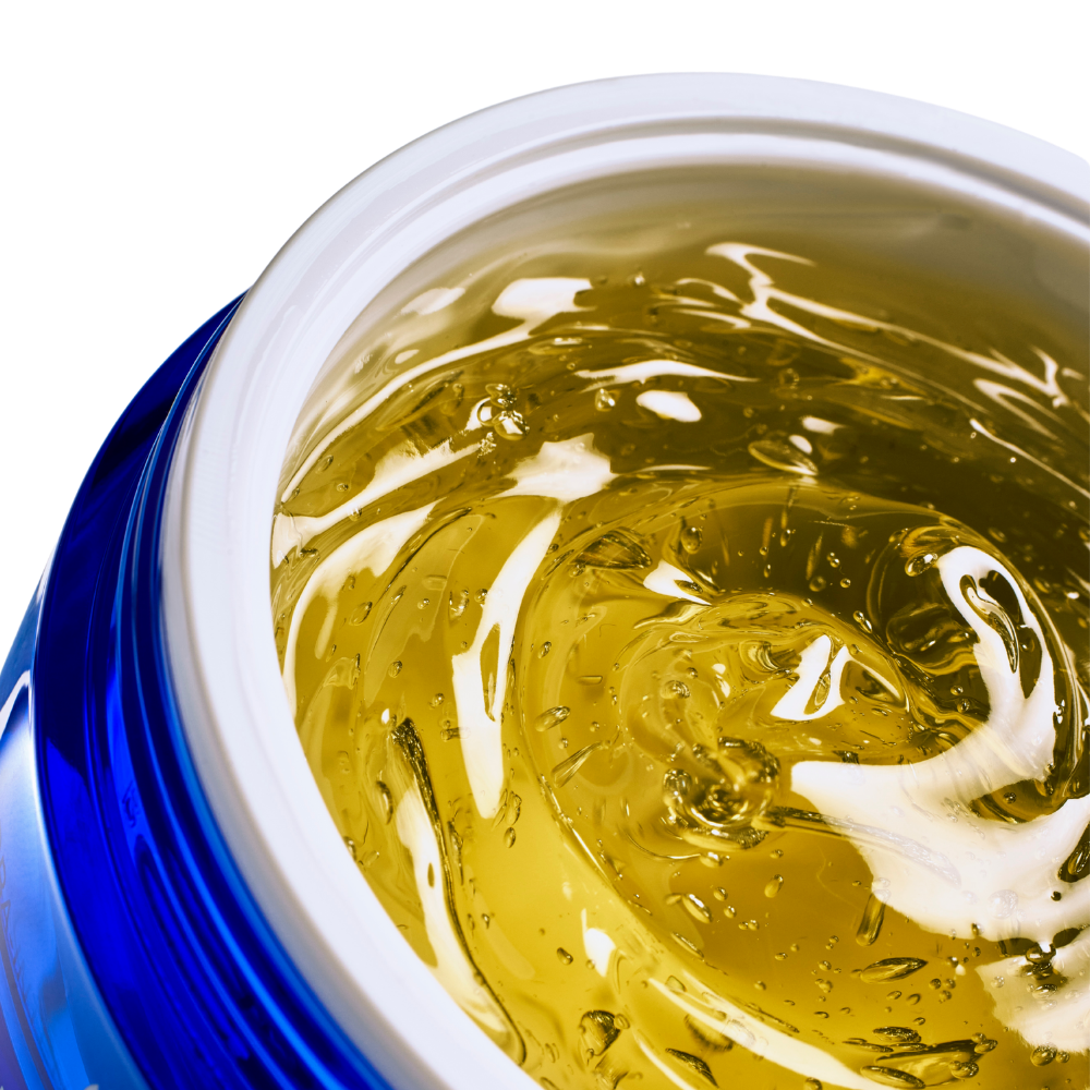 Close-up of a blue and white container with a yellowish gel masque texture iS Clinical Hydra-Intensive Cooling Masque