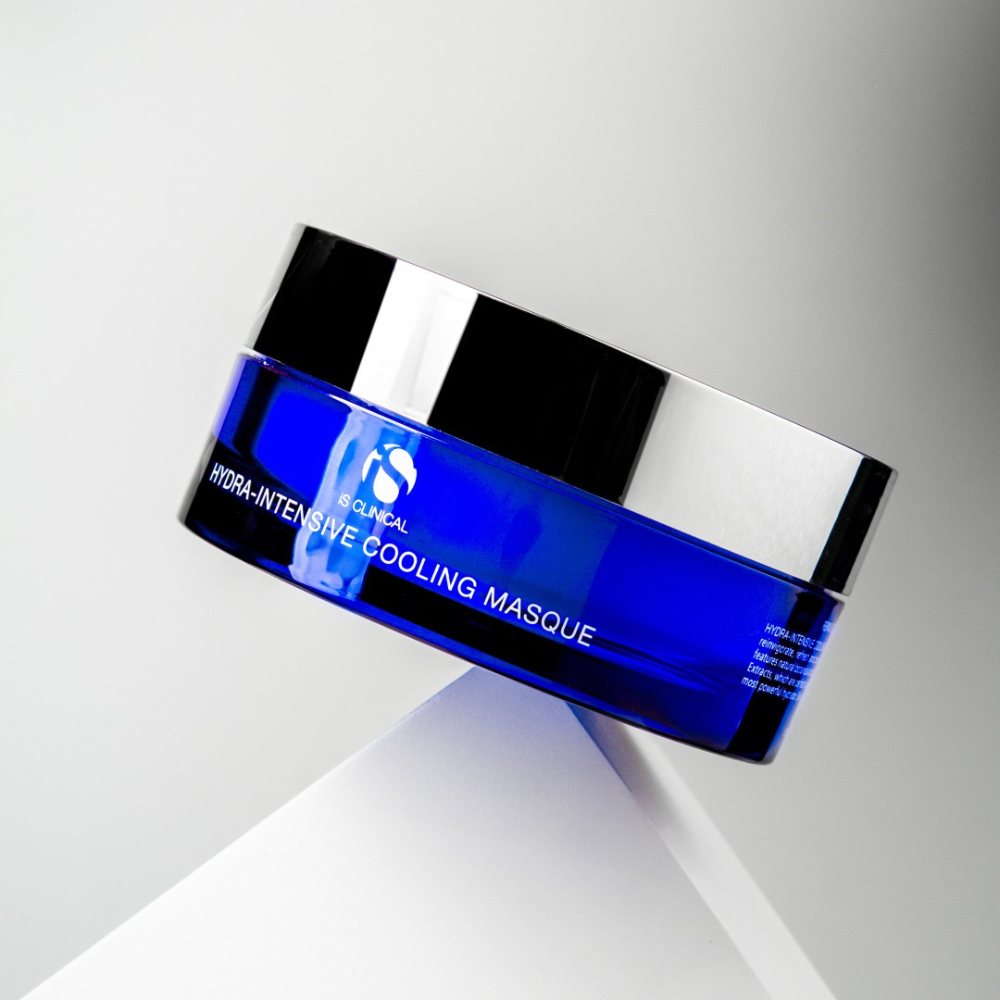Blue jar of skincare product iS Clinical Hydra-Intensive Cooling Masque on a gray background