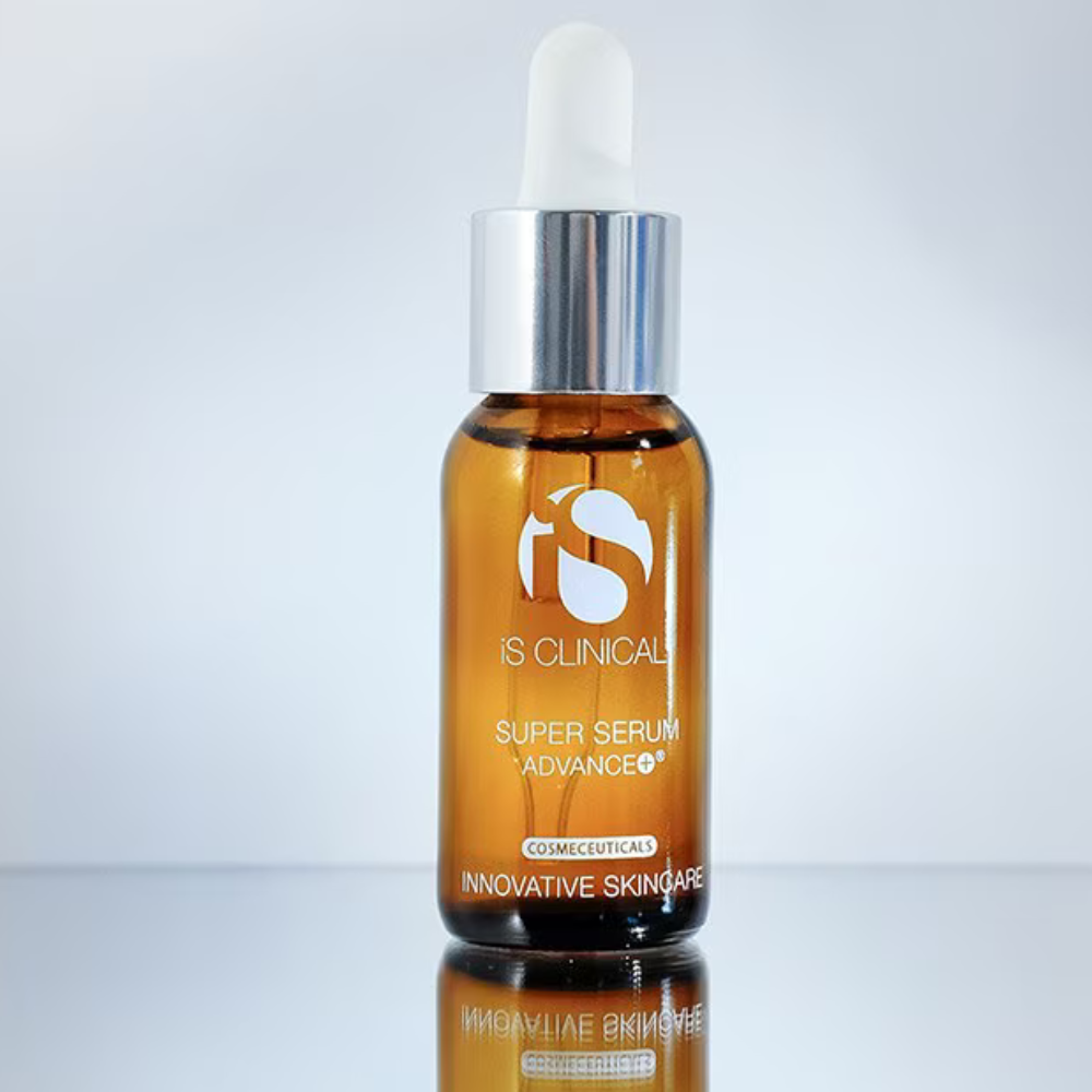 IS Clinical Super Serum Advance+ bottle with dropper on a reflective surface and light gray background
