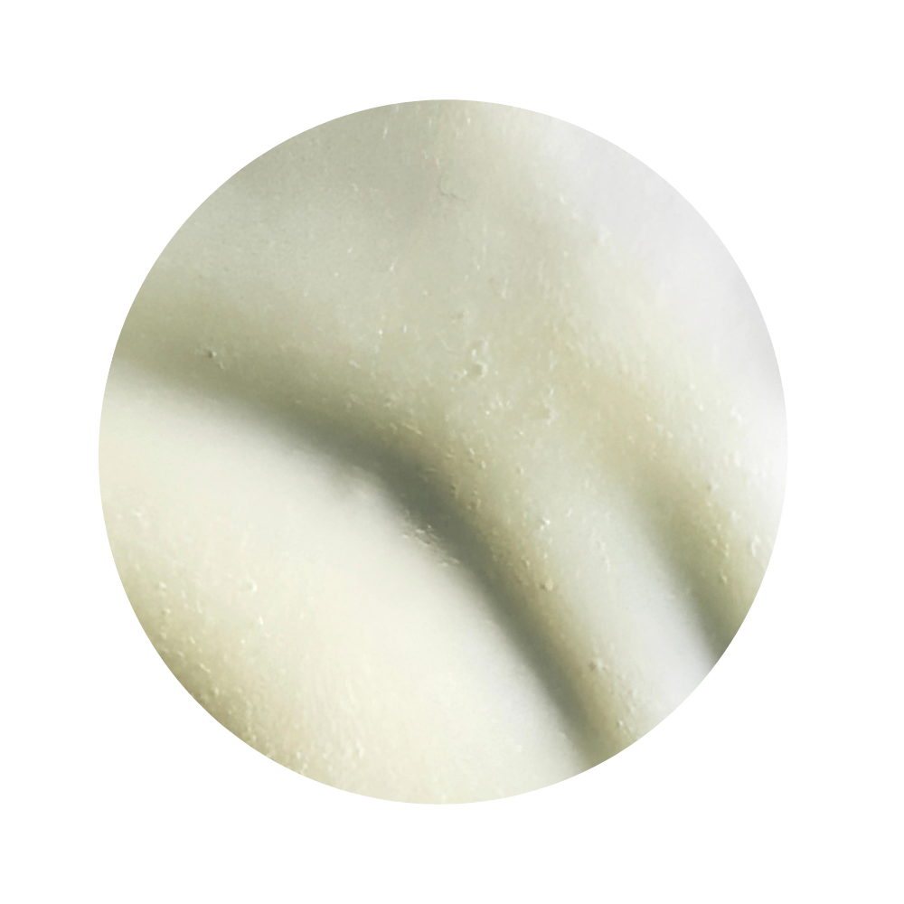 Close-up of a light beige color swatch of iS Clinical Tri-Active Exfoliating Masque