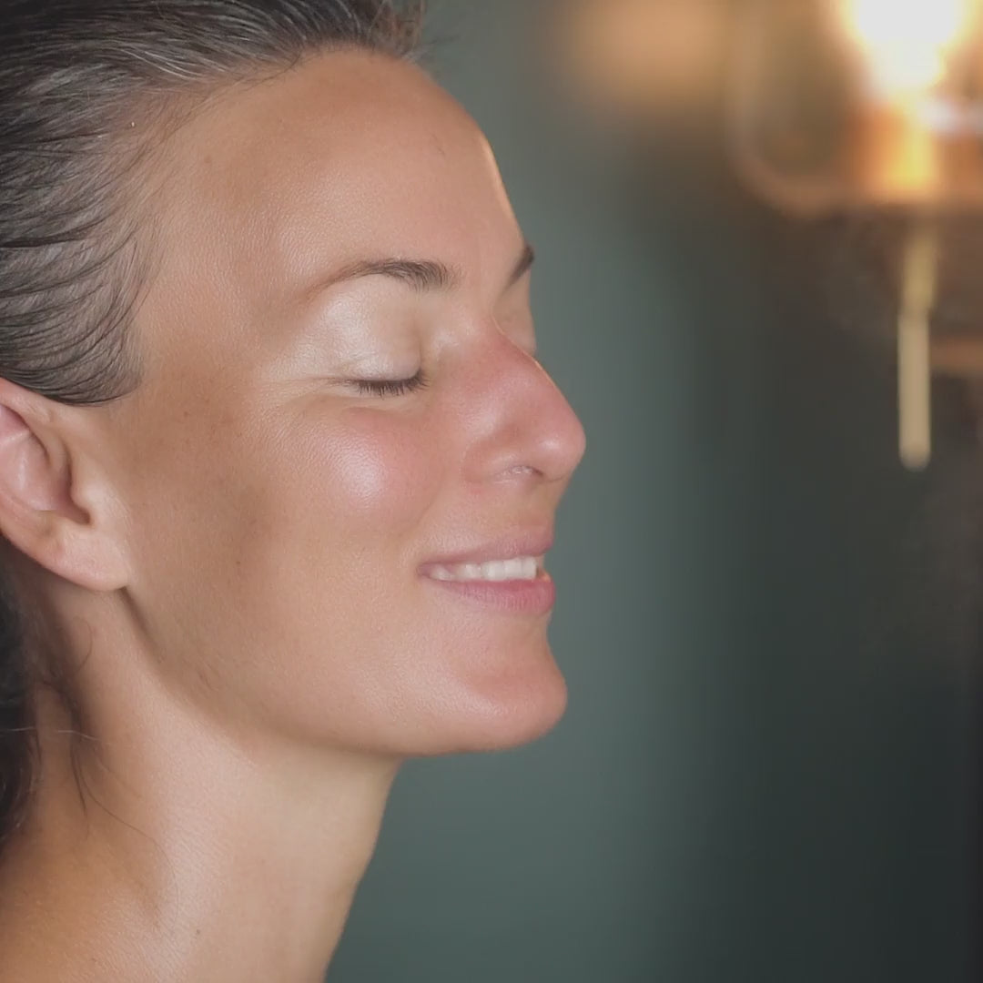 Video of a woman spraying May Lindstrom The Jasmine Garden Facial Mist onto face and on top of a face mask to massage it in