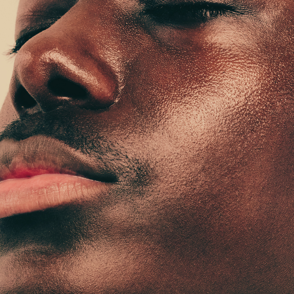 Close-up of a man's face with a neutral expression