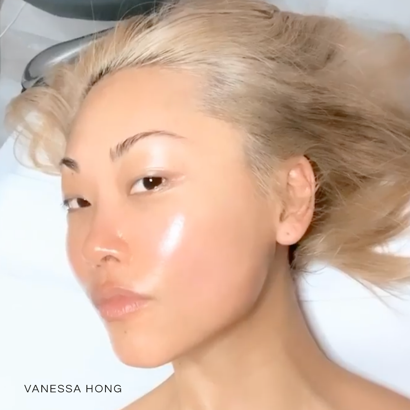 selfie image of Vanessa Hong on a spa table