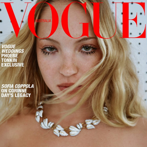 Vogue magazine cover with a woman wearing a necklace