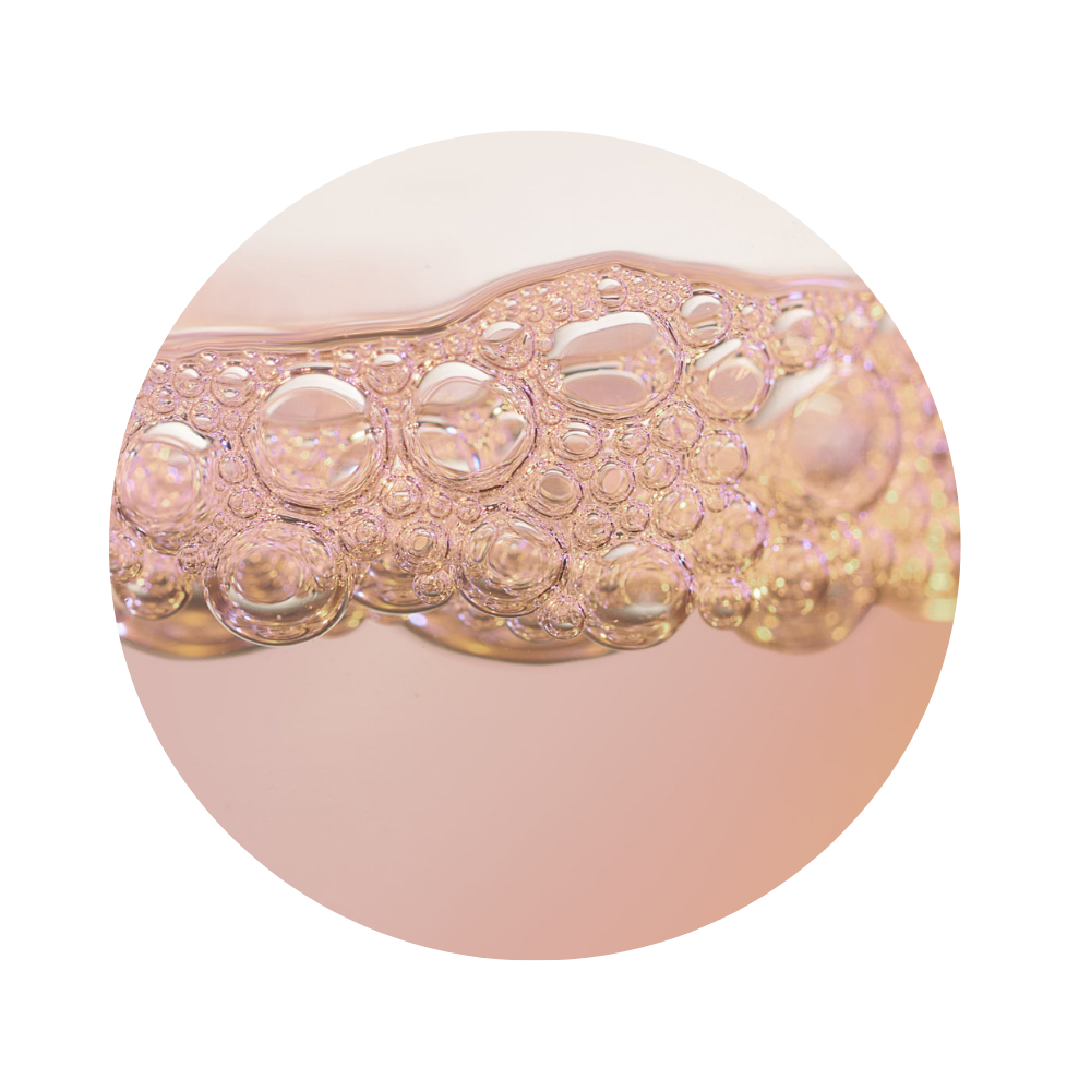 Close-up of a pink liquid texture of iS Clinical Super Serum Advance+