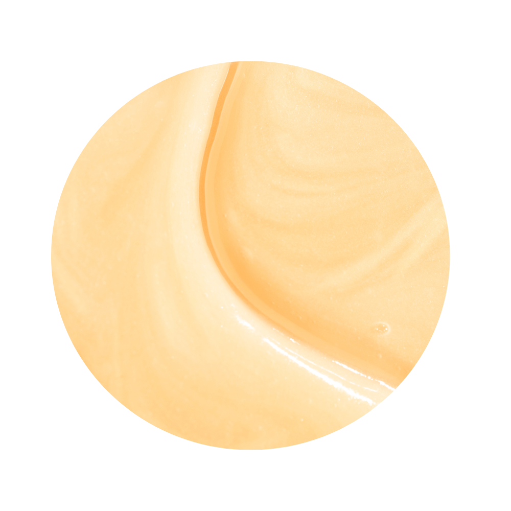 Close up of beige cream texture of iS Clinical Warming Honey Cleanser