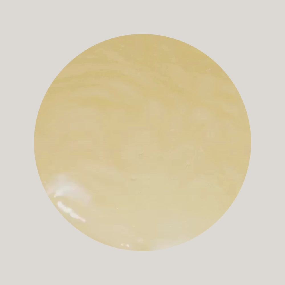 Video of swatch of iS Clinical Warming Honey Cleanser texture with a metal silver spatula mixing it 