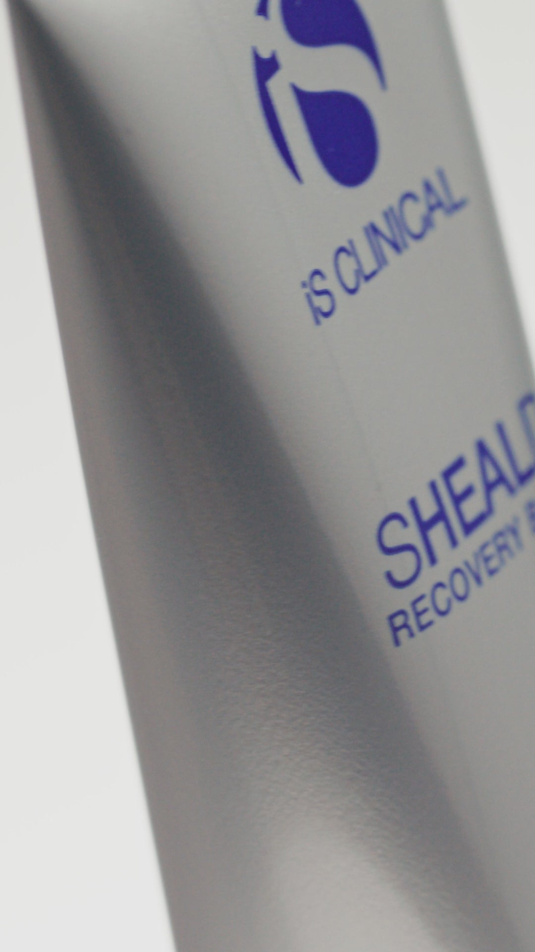 Video of iS Clinical Sheald Recovery Balm being applied by a woman by rubbing onto fingers and face