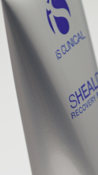 Video of iS Clinical Sheald Recovery Balm being applied by a woman by rubbing onto fingers and face