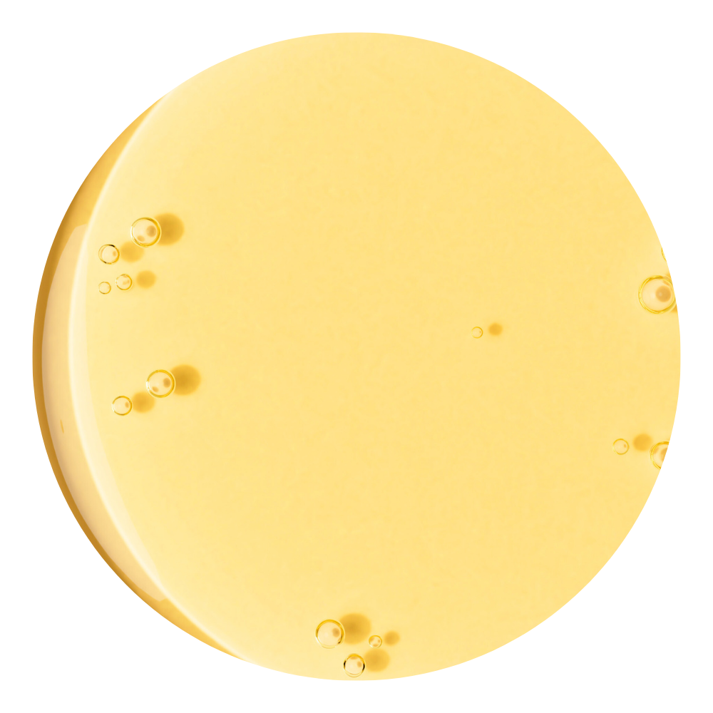 Close up of yellow liquid texture with droplets